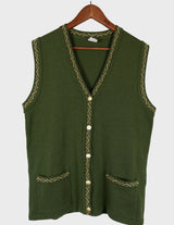 a woman is wearing a vintage 90s long green vest with golden details.