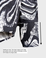 This black and white shirt doesn’t ask for attention — it just gets it. The abstract swirl pattern gives effortless chaos in the best way possible. Throw it on and let the print do the talking!