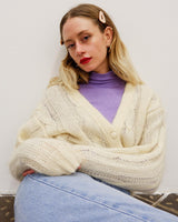 Slip into this cozy Premium Vintage 90s mohair superkid mix cable knit cardigan! Soft, furry and light transparent with a unique twist on a classic style, this cardigan is a must-have for any cable knit lovers!