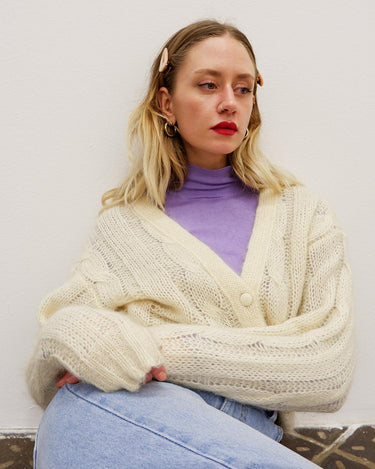 Slip into this cozy Premium Vintage 90s mohair superkid mix cable knit cardigan! Soft, furry and light transparent with a unique twist on a classic style, this cardigan is a must-have for any cable knit lovers!
