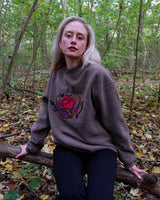 Get cozy in this Vintage 80s brown sweater, complete with beautiful floral stitching. Perfect for chilly days, this sweater is the ultimate way to stay snug. Cozyness is calling!