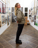 This Vintage 80s grey two row button leather jacket (thin material so perfect for spring) with its light brown undertone is a true timeless piece. From the two row button design to the leather material, this jacket is the perfect piece to embrace the classic look.