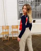 Look snazzy in this navy blue and red color mix Lacoste sweater! This longer fit (length: 66cm) is perfect for keeping you warm and looking snazzy.