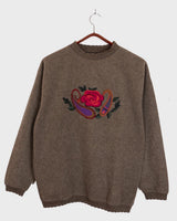 Get cozy in this Vintage 80s brown sweater, complete with beautiful floral stitching. Perfect for chilly days, this sweater is the ultimate way to stay snug. Cozyness is calling!