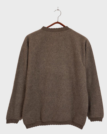 Get cozy in this Vintage 80s brown sweater, complete with beautiful floral stitching. Perfect for chilly days, this sweater is the ultimate way to stay snug. Cozyness is calling!