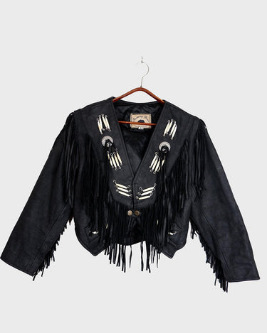 Unleash your inner rebel with this vintage 80s black leather crop fringe jacket. Made from high-quality leather, this XS jacket features fringe detailing that will make a statement. 