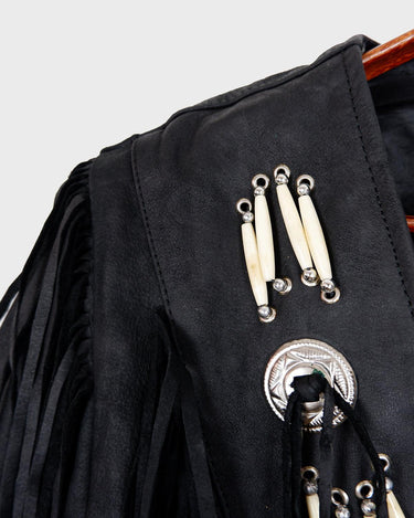 Unleash your inner rebel with this vintage 80s black leather crop fringe jacket. Made from high-quality leather, this XS jacket features fringe detailing that will make a statement. 