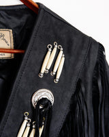 Unleash your inner rebel with this vintage 80s black leather crop fringe jacket. Made from high-quality leather, this XS jacket features fringe detailing that will make a statement. 