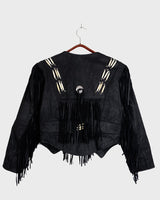 Unleash your inner rebel with this vintage 80s black leather crop fringe jacket. Made from high-quality leather, this XS jacket features fringe detailing that will make a statement. 