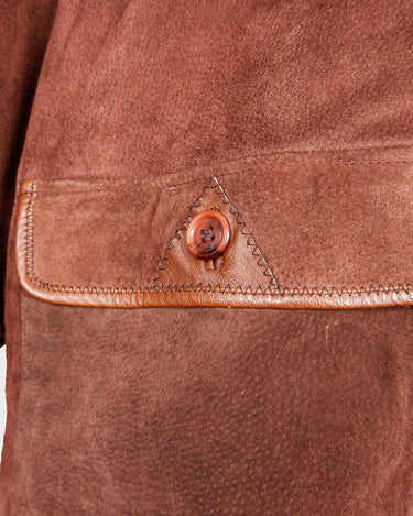 Get ready to slay in this vintage 80s hood coat! Made from brown-red leather and fake fur applications this coat is perfect for keeping you warm on those chilly days.