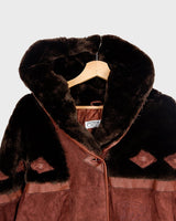 Get ready to slay in this vintage 80s hood coat! Made from brown-red leather and fake fur applications this coat is perfect for keeping you warm on those chilly days.