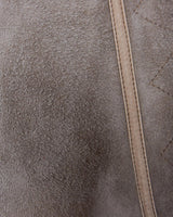 Get cozy in style with this vintage 80s shearling coat in brown. Its timeless design and soft warmth will have you feeling snug and stylish all season long. Don't miss out on this irresistible call to coziness!