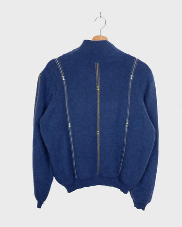Add some shimmer to your wardrobe with this designer vintage Les copains blue turtlekneck sweater. Perfect for M to L sizes, this sweater will keep you cozy and stylish with its unique shimmering details. Say goodbye to boring sweaters and hello to one-of-a-kind fashion!