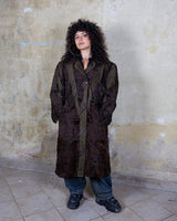Add a touch of eccentricity to your wardrobe with this vintage 80s long brown leather fur coat. Featuring unique patchwork leather and a cozy fur lining, this XL-XXL coat is perfect for making a bold statement