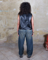 Embrace your inner rebel with this vintage 80s 90s black biker leather vest! Perfect for adding a touch of edge to any outfit, this vest is full of personality and attitude. Made with genuine leather, it offers both style and durability.