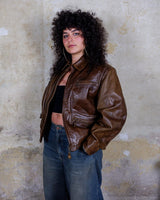 Fall in love with this italian vintage 80s brown leather jacket! With its classic look, warm wool lining, and thick leather material, you'll look and feel great while staying cozy!