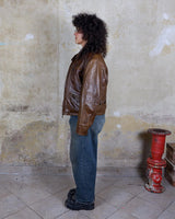 Fall in love with this italian vintage 80s brown leather jacket! With its classic look, warm wool lining, and thick leather material, you'll look and feel great while staying cozy!