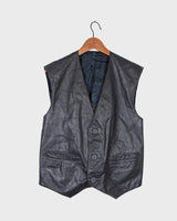Rock your vintage style with our 90s grey leather vest! This unique piece features a playful paisley pattern at the back for a touch of fun.