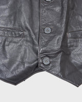 Rock your vintage style with our 90s grey leather vest! This unique piece features a playful paisley pattern at the back for a touch of fun.
