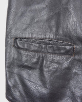 Rock your vintage style with our 90s grey leather vest! This unique piece features a playful paisley pattern at the back for a touch of fun.