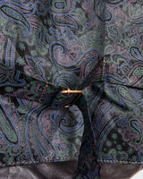 Rock your vintage style with our 90s grey leather vest! This unique piece features a playful paisley pattern at the back for a touch of fun.