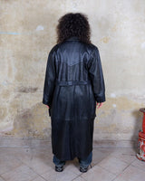 This vintage 80s coat features a fierce black animal print, adding a unique touch to any outfit. The belted waist cinches in for a flattering fit, making you feel confident and channeling your inner wild side.