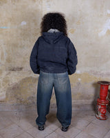 The Premium Vintage 90's ENERGIE black denim hooded jacket (used look) is the must-have item for those who want to add some edge to their wardrobe. Its unique design and quality materials give off a cool, laid-back vibe!