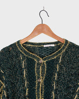 Add some sparkle to your wardrobe with this vintage 80s green cardigan, featuring eye-catching golden details. Perfect for layering and dressing up any outfit!