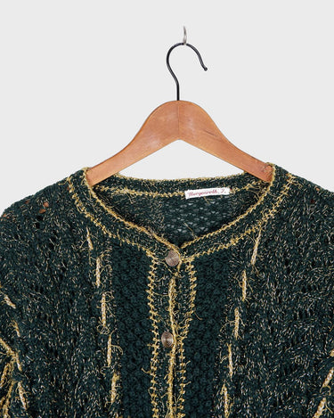 Add some sparkle to your wardrobe with this vintage 80s green cardigan, featuring eye-catching golden details. Perfect for layering and dressing up any outfit!