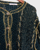 Add some sparkle to your wardrobe with this vintage 80s green cardigan, featuring eye-catching golden details. Perfect for layering and dressing up any outfit!