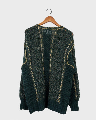 Add some sparkle to your wardrobe with this vintage 80s green cardigan, featuring eye-catching golden details. Perfect for layering and dressing up any outfit!