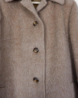 This Premium Vintage 80s llama coat is a real keeper! It's fluffy and cuddly in a beige brown A-form, perfect for sprinkling some furry fun into your style.