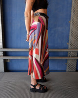 This Y2k skirt serves pure elegance with its flowing silhouette and vibrant geometric print in magenta, teal, orange, and warm brown. Light and easy to wear, it’s comfortable and anything but boring—designed for those who dress with intention.