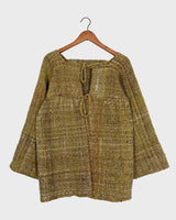 This vintage 80s 90s jacket is anything but ordinary - with a mix of green and multicolor sahde, it's a playful and unique addition to any wardrobe. The natural fabric adds to the relaxed, casual vibe!