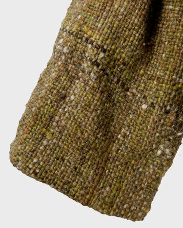 This vintage 80s 90s jacket is anything but ordinary - with a mix of green and multicolor sahde, it's a playful and unique addition to any wardrobe. The natural fabric adds to the relaxed, casual vibe!
