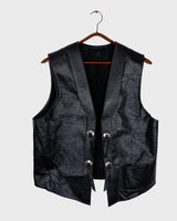 Embrace your inner rebel with this vintage 80s 90s black biker leather vest! Perfect for adding a touch of edge to any outfit, this vest is full of personality and attitude. Made with genuine leather, it offers both style and durability.
