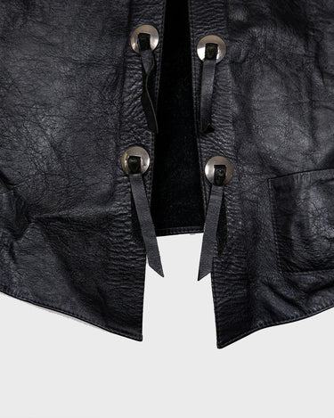 Embrace your inner rebel with this vintage 80s 90s black biker leather vest! Perfect for adding a touch of edge to any outfit, this vest is full of personality and attitude. Made with genuine leather, it offers both style and durability.