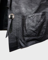 Embrace your inner rebel with this vintage 80s 90s black biker leather vest! Perfect for adding a touch of edge to any outfit, this vest is full of personality and attitude. Made with genuine leather, it offers both style and durability.