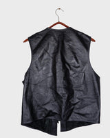 Embrace your inner rebel with this vintage 80s 90s black biker leather vest! Perfect for adding a touch of edge to any outfit, this vest is full of personality and attitude. Made with genuine leather, it offers both style and durability.