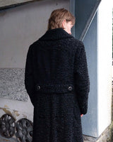 Wrap yourself in elegance with this vintage 80s 90s black real fur coat. This timeless piece adds a touch of luxury to any outfit. 