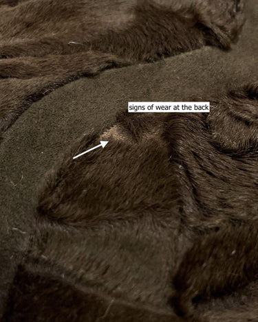 Add a touch of eccentricity to your wardrobe with this vintage 80s long brown leather fur coat. Featuring unique patchwork leather and a cozy fur lining, this XL-XXL coat is perfect for making a bold statement