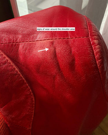 This vintage red leather jacket from the 80s is anything but outdated. With light shoulder pads to add structure, it's the statement piece!