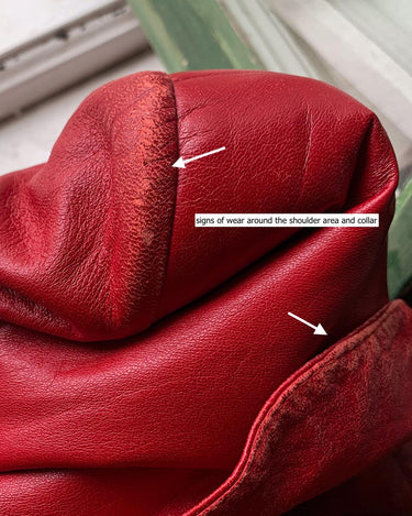 This vintage red leather jacket from the 80s is anything but outdated. With light shoulder pads to add structure, it's the statement piece!