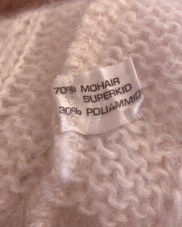 Slip into this cozy Premium Vintage 90s mohair superkid mix cable knit cardigan! Soft, furry and light transparent with a unique twist on a classic style, this cardigan is a must-have for any cable knit lovers!