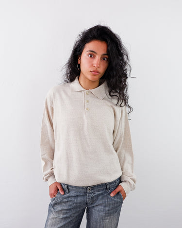 a woman is wearing a Preloved cream white polo sweater | M-L from the vintage online shop vintivintage.com