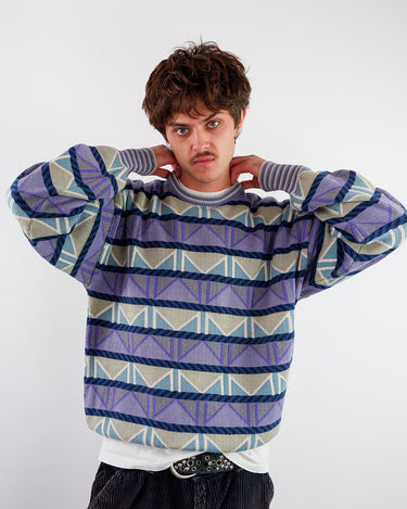 a woman is wearing a Vintage 80s 90s colorful geometric pattern sweater L-XL from the online shop vinti vintage