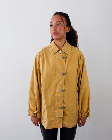 a woman is wearing a Vintage 80s 90s yellow MARELLA lightweight jacket with fireman clasp | L from the online shop vinti vintage