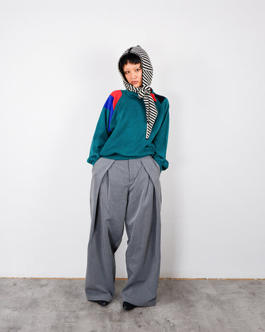 a woman is wearing a Vintage 80s green fleece style pullover with multicolor stripes mock neck in size s-m from the online shop vinti vintage
