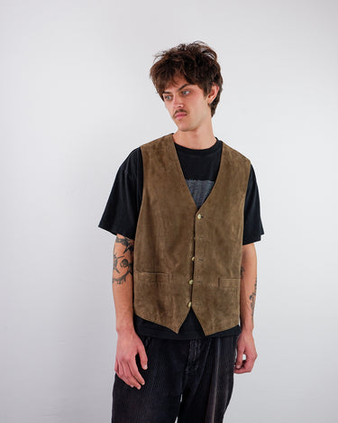 a man is wearing a Vintage 90s MC NEAL brown suede leather vest | L from the online shop vinti vintage