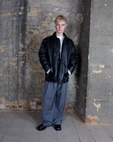 This vintage 90s black leather jacket brings effortless attitude with its clean, minimalist design, subtle panel detailing, and naturally textured finish. The relaxed fit and classic button front give it that understated cool vibe. Looking for a timeless leather jacket that does all the talking without trying too hard?